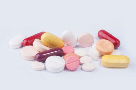 Medical pills with different size,shape and color on white background.の写真素材
