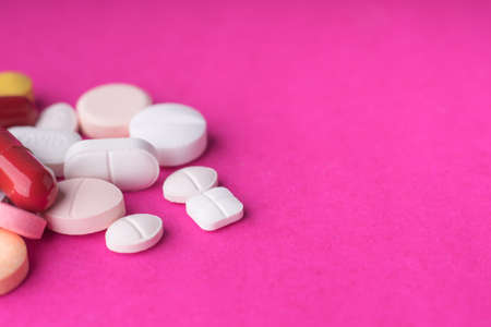 Medical pills on pink background.の写真素材
