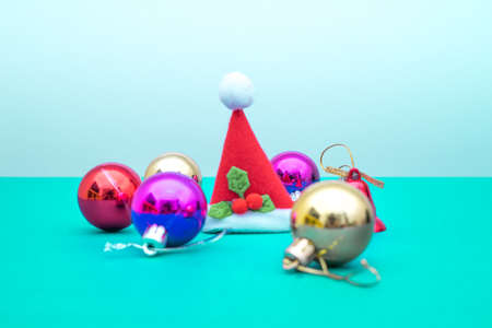 Christmas ornament balls and santa hat with copy space.Christmas deco concept for background.の写真素材
