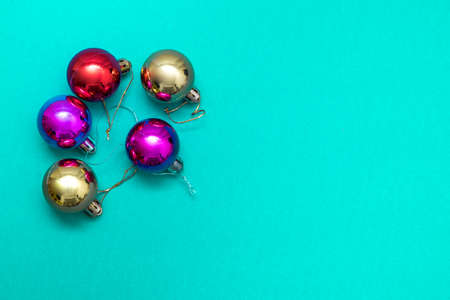Christmas ornament balls and santa hat on grey background.の写真素材