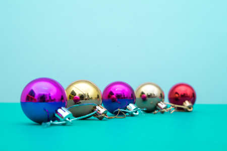 Christmas ornament balls and santa hat on grey background.の写真素材
