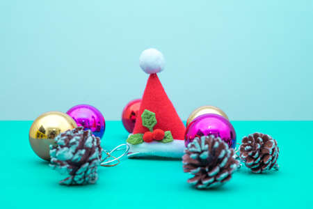 Christmas ornament balls and santa hat with copy space.Christmas deco concept for background.の写真素材