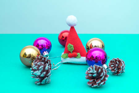 Christmas ornament balls and santa hat with copy space.Christmas deco concept for background.の写真素材