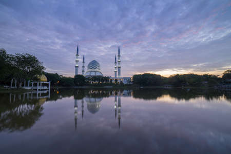 Blue Mosque also known as Sultan Salahuddin Abdul Aziz Shah Mosque during glorious sunrise.の写真素材