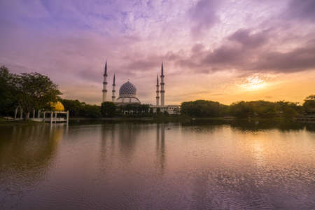 Blue Mosque also known as Sultan Salahuddin Abdul Aziz Shah Mosque during glorious sunrise.の写真素材