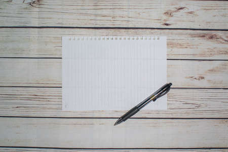 Pen and blank note paper on vintage wooden table.Background concept with copy space.の写真素材