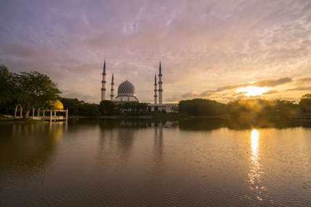 Blue Mosque also known as Sultan Salahuddin Abdul Aziz Shah Mosque during glorious sunrise.の写真素材