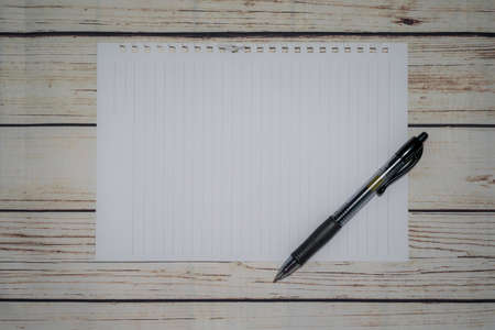 Pen and blank note paper on vintage wooden table.Background concept with copy space.の写真素材