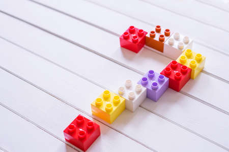 Colorful Kid's block toy forming a big Question mark.Child education concept.の写真素材