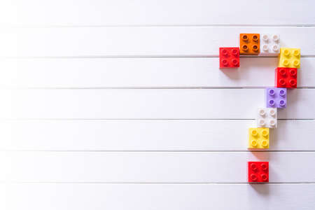 Colorful Kid's block toy forming a big Question mark.Child education concept.の写真素材
