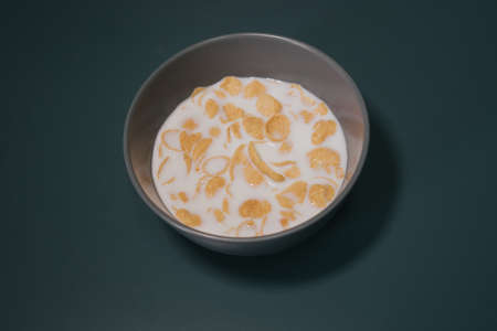 Cornflake cereal in the bowl with full cream milk.の写真素材