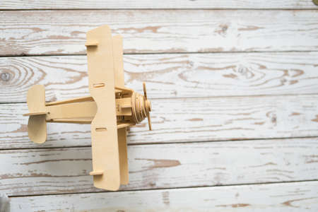 Wooden Airplane toy on vintage wooden table with copy space.Travel concept.の写真素材
