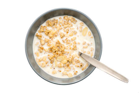 Granola,Almond and oat cereals in a bowl with Full cream milk.Healthy Food for breakfast.の写真素材