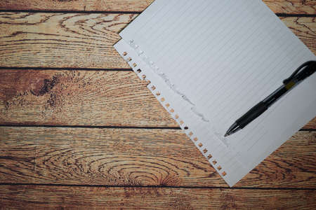 Pen and blank note paper on vintage wooden table.Background concept with copy space.の写真素材