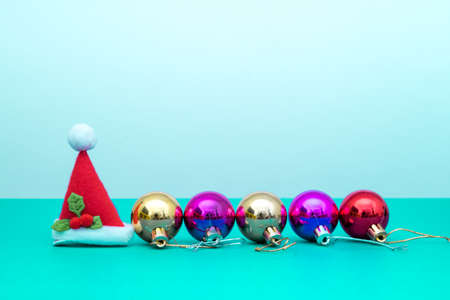 Christmas ornament balls and santa hat with copy space.Christmas deco concept for background.の写真素材