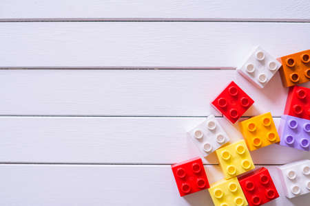 Colorful Kid's block toy forming a heart shape on white wooden table.Child education concept.の写真素材