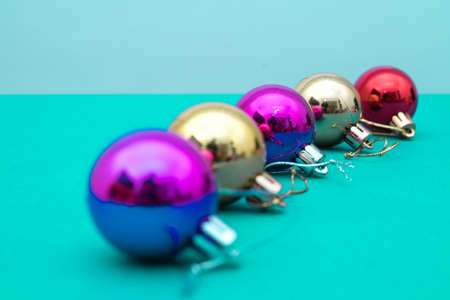 Christmas ornament balls and santa hat on grey background.の写真素材