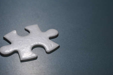 A piece of Blank white puzzle on chalkboard with copy space.Problem and solution concept.の写真素材