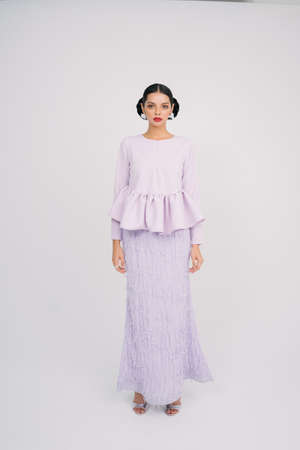 Beautiful female model wearing Asian traditional dress for Muslim woman.Eid ul fitr fashion and beauty.の写真素材