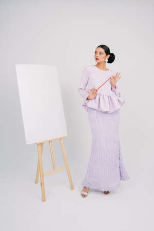 Beautiful female model wearing Asian traditional dress for Muslim woman.Eid ul fitr fashion and beauty.の写真素材