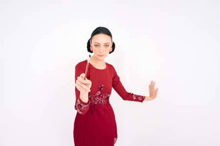 Beautiful female models wearing Asian traditional dress for Muslim woman isolated over white background. Eid al fitr fashion and beauty.の写真素材