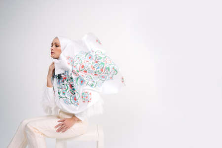 Beautiful Arab Female model wearing hijab isolated over white background.Close up shot.Hijab Fashion.の写真素材
