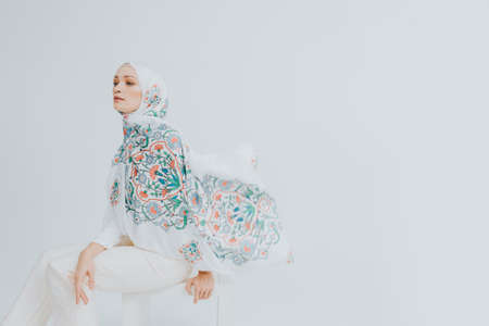 Beautiful Arab Female model wearing hijab isolated over white background.Close up shot.Hijab Fashion.の写真素材