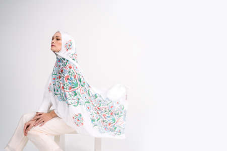 Beautiful Arab Female model wearing hijab isolated over white background.Close up shot.Hijab Fashion.の写真素材