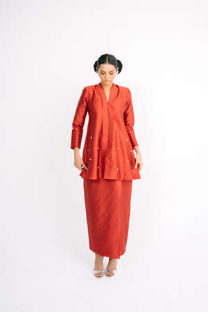 Beautiful female model wearing Asian traditional dress for Muslim woman isolated over white background.Eid ul fitr fashion and beauty.の写真素材