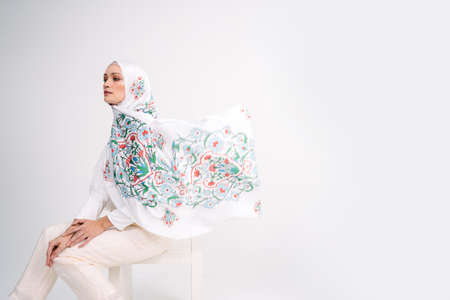 Beautiful Arab Female model wearing hijab isolated over white background.Close up shot.Hijab Fashion.の写真素材