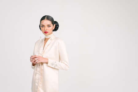 Beautiful girl wearing Baju Kurung (Asian Malay traditional dress) isolate over white background.Modern female fashion fro Eid Ul Fitr celebration or formal event.の写真素材
