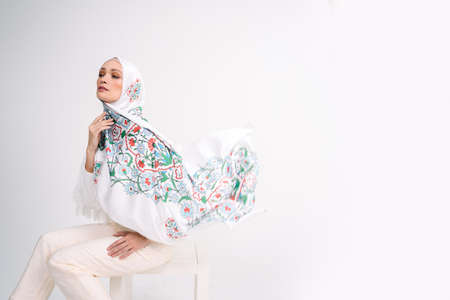 Beautiful Arab Female model wearing hijab isolated over white background.Close up shot.Hijab Fashion.の写真素材