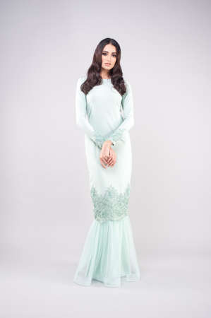 Beautiful female model wearing Malaysia traditional cloth or dress known as "BAJU KURUNG". AIDILFITRI FASHION.の写真素材