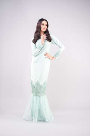 Beautiful female model wearing Malaysia traditional cloth or dress known as "BAJU KURUNG". AIDILFITRI FASHION.の写真素材