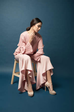 Beautiful middle east female model wearing casual yet elegant cloth.Studio shot.Professional model.の写真素材
