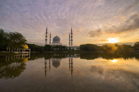 Blue Mosque also known as Sultan Salahuddin Abdul Aziz Shah Mosque during glorious sunrise.の写真素材