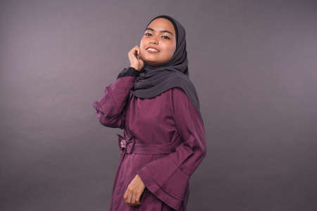 Portraiture of Muslim teenager female wearing hijab.Studio shot.の写真素材