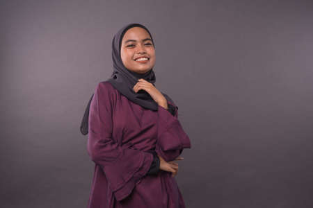 Portraiture of Muslim Girl wearing hijab.Happy smiling face reaction.の写真素材