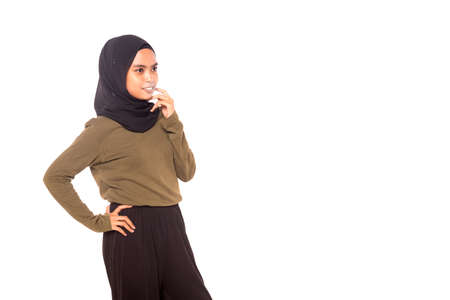 Casual Hijab Fashion.Cute Muslim girl with casual dress and hijab isolated over white background.の写真素材