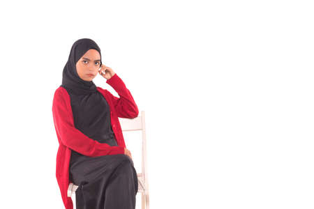 Casual Hijab Fashion.Cute Muslim girl with casual dress and hijab isolated over white background.の写真素材