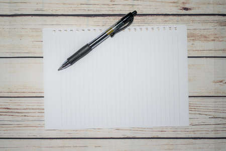 Pen and blank note paper on vintage wooden table.Background concept with copy space.の写真素材