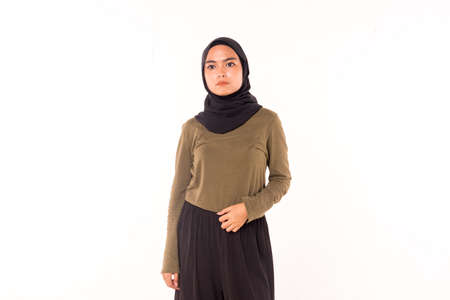 Casual Hijab Fashion.Cute Muslim girl with casual dress and hijab isolated over white background.の写真素材