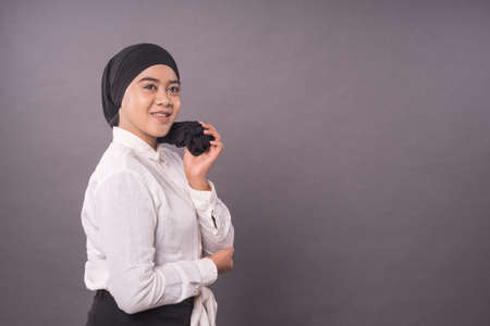 Portraiture of young asian girl wearing turban.Studio shot.の写真素材