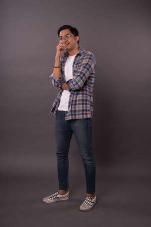 Portraiture of Asian boy with casual out fit.Studio shot.の写真素材
