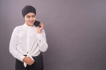 Portraiture of young asian girl wearing turban.Studio shot.の写真素材