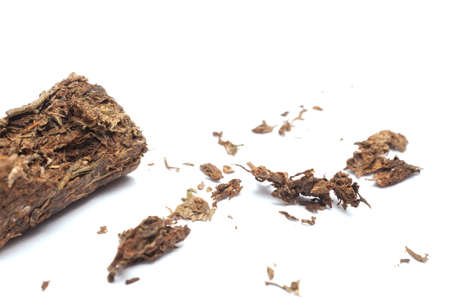 Compacted dried marijuana isolated over white background.の写真素材