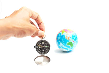 World globe and compass isolated over white background with copy space.Travel the world concept shot.の写真素材