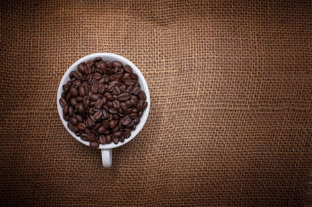 Close up shot of coffee beans in with vintage background with copy space.