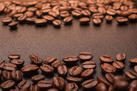 Close up shot of coffee beans on black board with copy space.の写真素材