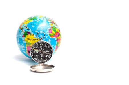 World globe and compass isolated over white background with copy space.Travel the world concept shot.の写真素材